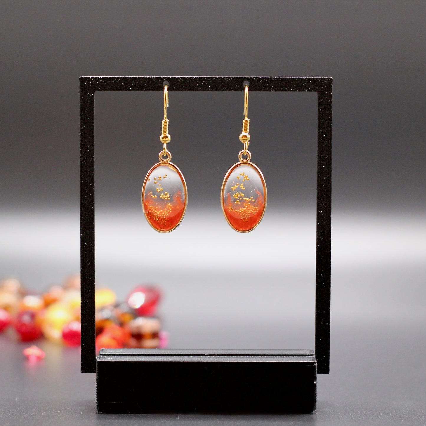 Oorbellen ovaal roest rood met goud