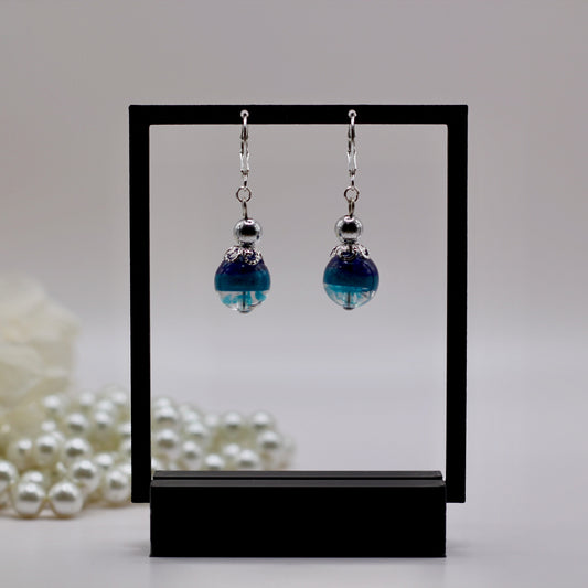 Oorbellen blauw tinten bol met ster