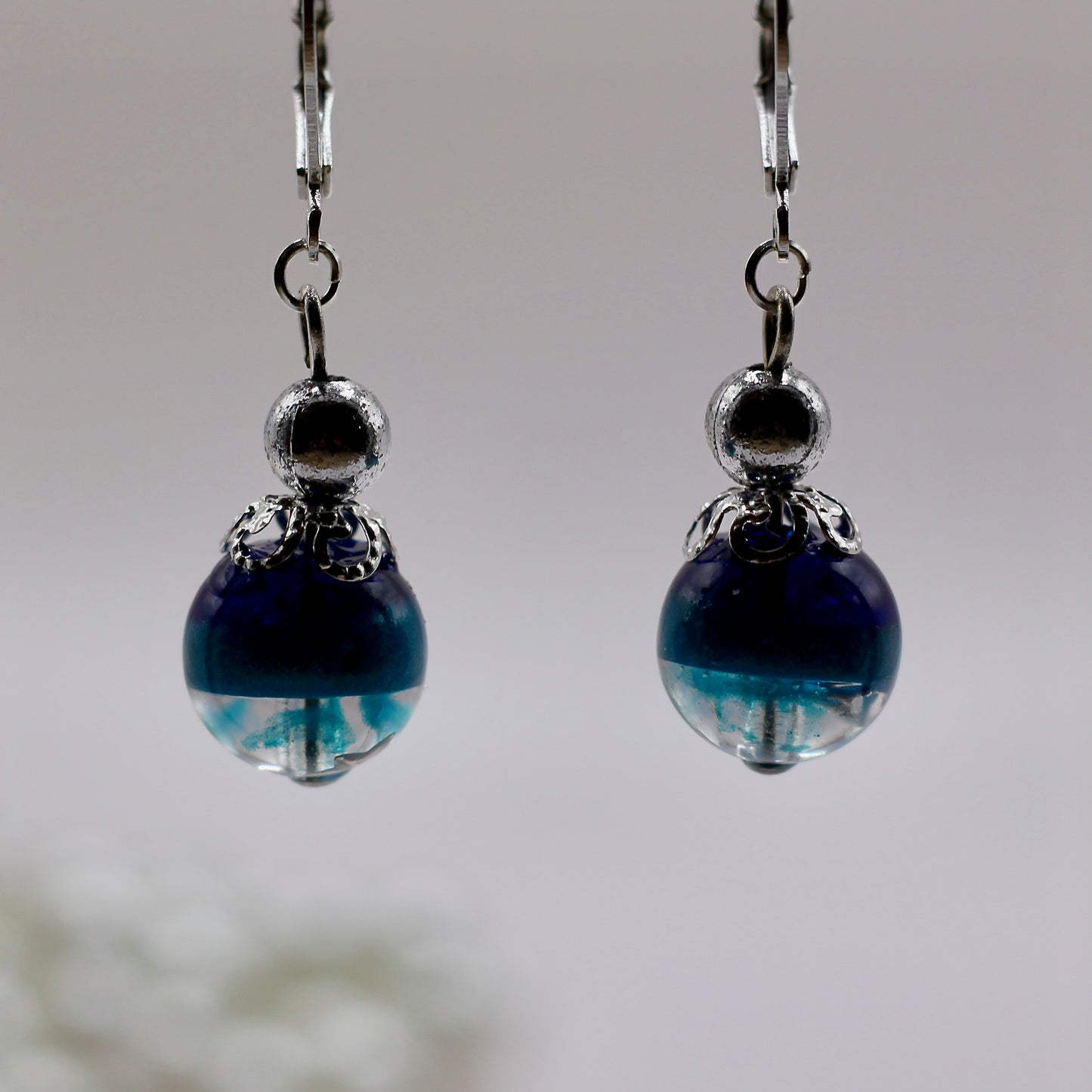 Oorbellen blauw tinten bol met ster